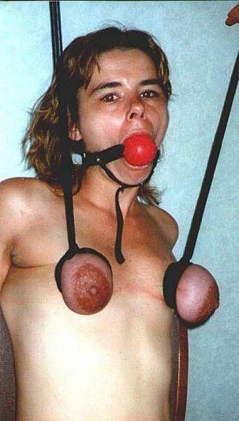 Suspended By Tits - Woman tortures her own big tits. BDSM content - 5 pics.